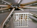 Close up of burner kit tray with pilot and burner outlet tubes